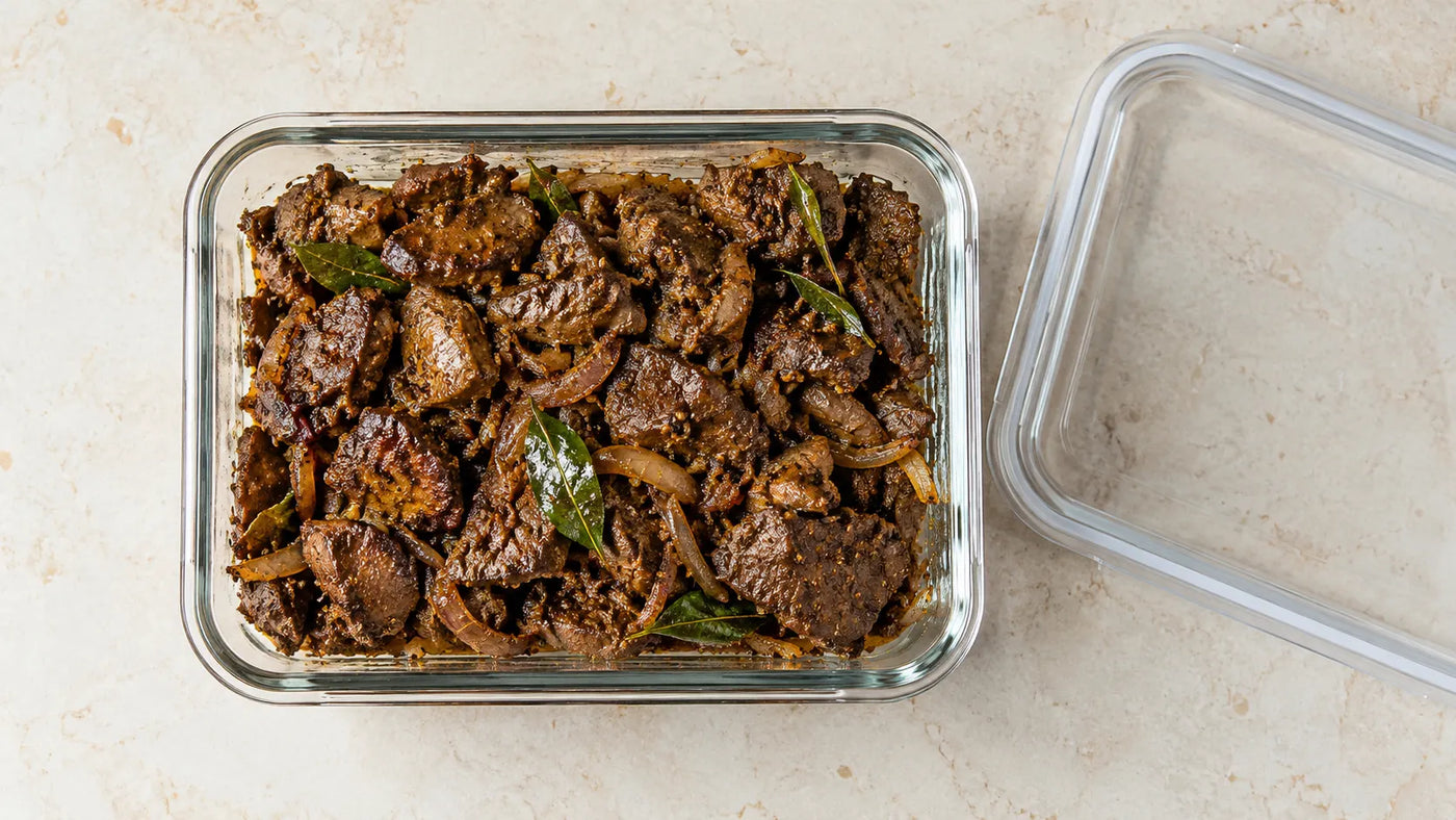 Fresh mutton liver stored in a sealed container inside a refrigerator